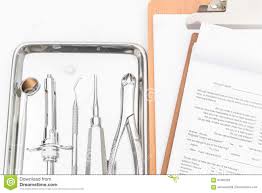 Dental Tools Equipment And Dental Chart On White Background