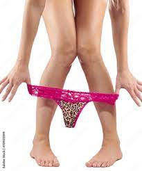 Sexy legs pulling panties down. Stock Photo | Adobe Stock