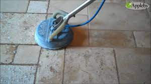 cleaning tumbled travertine floor near