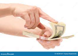 Пачка долларов денег в руках Стоковое Изображение - изображение  насчитывающей одно, облечение: 105200139