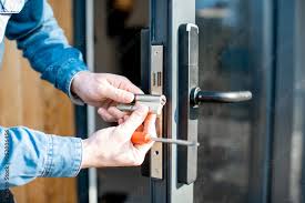 Man Changing Core Of A Door Lock Of The