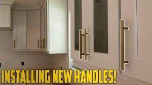 install new handles on kitchen cabinets