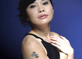 Canadian actress Sook-yin Lee has a dancing figure on her arm - 3310362