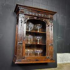 antique oak hang cabinet with glass