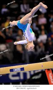 gymnast jump balance beam stock photos