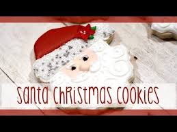 Before you bake the cookies, use a straw to punch a hole in the dough (this is where you'll thread the ribbon for hanging). 100 Decorated Santa Cookies Youtube Santa Cookies Santa Cookies Decorated Christmas Cookies