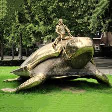 Boy On Turtle Sculpture