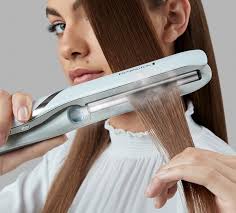 • working on one section at a time, run the straightener through the entire. S9001au Hydraluxe Pro Straightener Remington