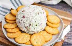 cheese ball on a plate with ers