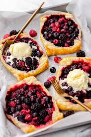 These miniature empanadas, tender pastry dough wrapped around pineapple filling this lightly sweetened fruit dessert recipe looks beautiful with the red raspberries suspended in. Mixed Berry Puff Pastry Tarts Veronika S Kitchen