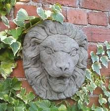stone garden lion face head wall water