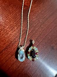 14k gold blue topaz necklace and gem