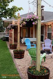 How to make your own backyard patio. Diy Patio Area With Texas Lamp Posts Cheap Backyard Makeover Ideas Backyard Decor Diy Garden Patio