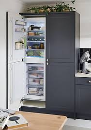 The door has a space routed out on the door and drawer panels so there is no need for external handles. Beko Bcb5050f 50 50 White Integrated Fridge Freezer Diy At B Q