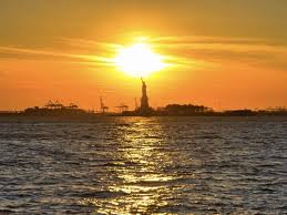 seeing the statue of liberty at sunset