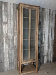 rustic linen cabinet with glass door