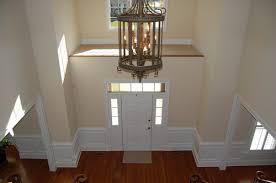 decorate a high ledge in a front foyer