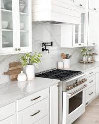 36 black hardware on white cabinets for