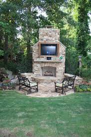 outdoor fireplace with built in tv
