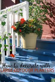 to decorate with large outdoor planters