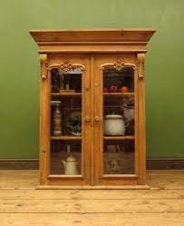 antique pine glazed wall cabinet for