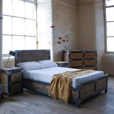 This bedroom feels industrial yet chic, as perforated windows create circles of light over a wooden floor and matching headboard. Kingsize Industrial Bed Frame Handcrafted Furniture Etsy
