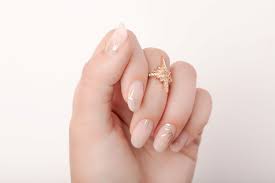 nail design with gold sunburst