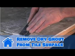 dry grout from tile surface