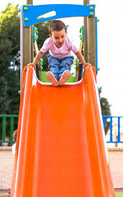 How fast is she moving in 3.45 s later? Child Sliding Down A Slide In A Playground By Acalu Studio