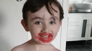 little boy covered in makeup loves
