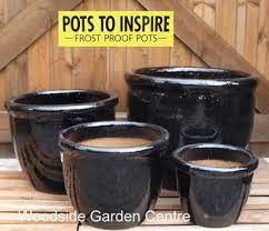 large black glazed pot roll top planter