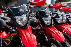 rows of honda xrm 125 motorcycles for