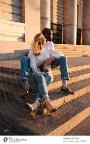 romantic couple resting on old building
