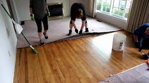 carpet removal exposing hardwood floors