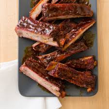 sticky ribs on a charcoal grill