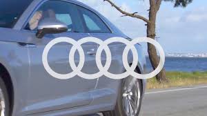 the story behind audi s four ring logo