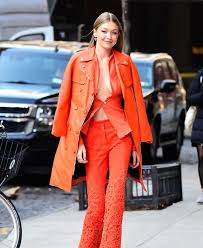 Gigi gives her classic blue denim some edge with a black leather coat and dr. Stylesthings Gigi Hadid Walks Through The Winter New York In An Orange Shirt On His Naked Body