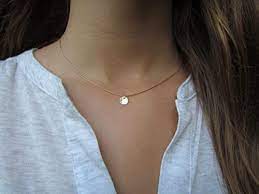 Almost all of cinco 's accessories ring in under $100. Amazon Com Tiny Gold Disc Necklace Dainty Gold Necklace Hammered Gold Disc Necklace Delicate Gold Necklace Simple Everyday Jewelry Dainty Pendant Handmade Products