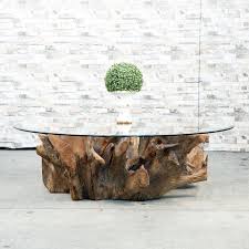 The pedestal is made from genuine teak roots that are dug up, cleaned, sanded and finished with a clear lacquer coat. Habini Root Coffee Table Square