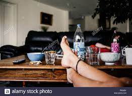 Woman With Feet Up On Coffee Table