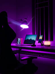 laptop on desk in purple room free
