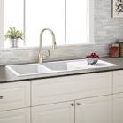 White kitchen sink with drainboard