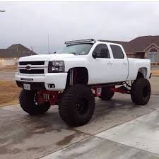 Jacked up chevy trucks pictures. Lifted Chevrolet Silverado White Truck Chevy Mudding Anyone Jacked Up Trucks Chevy Trucks Trucks