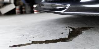 remove oil stains from a driveway