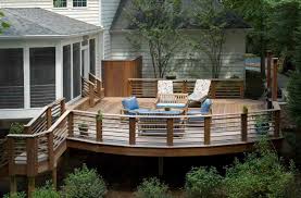 Deckorators spindles wood deck with horizontal skirting deck boards the handrails were placed in from the edge of the steps so flower pots could sit. Deck Railing Designs That Mix Looks And Function