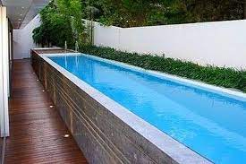 Even if you don't have space for a full pool in your backyard, you may still be able to get in a good aquatic workout by putting in an inground lap pool. Small Yard Small Pool 25 Tiny Pools Intheswim Pool Blog
