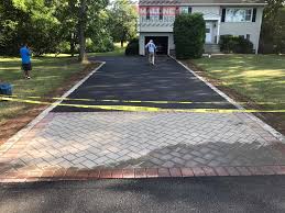 Installing edging around a driveway is more complex than installing it around a flowerbed or garden. Paving Installation With Cambridge Apron And Belgium Border Blocks Maloney Paving And Masonry