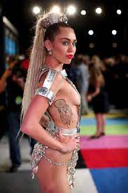 Check spelling or type a new query. Miley Cyrus Maybe Didn T Realize She Got A Tattoo Of Saturn Celebrity News Zimbio