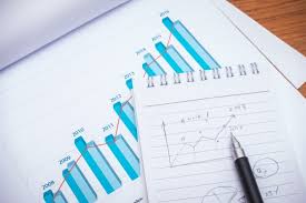 Financial Charts With Pencil On Table Photo Free Download