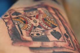These tattoos can be drawn with playing cards surrounded by flames, aces and eights representing the dead man's hand, or a heart surrounded by dice and the words not to gamble with love. Playing Card Tattoo Designs Meanings Pictures And Ideas Tatring